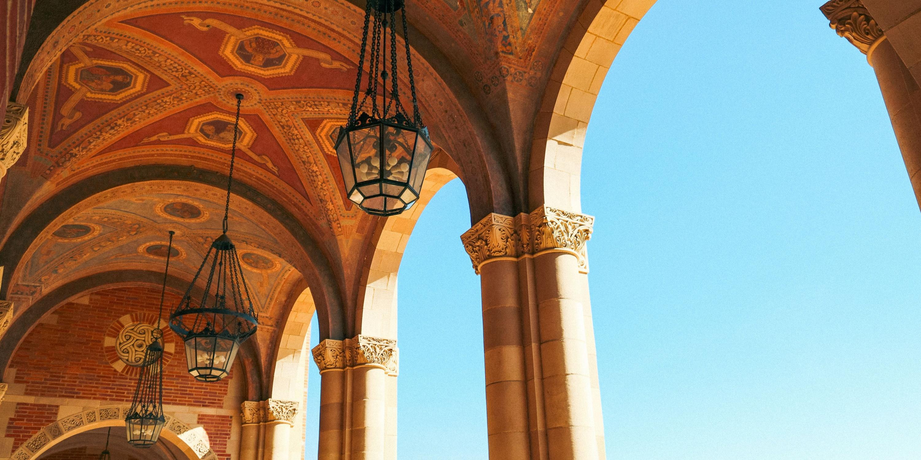 Ceiling architecture of a building at UCLA against a bright blue sky