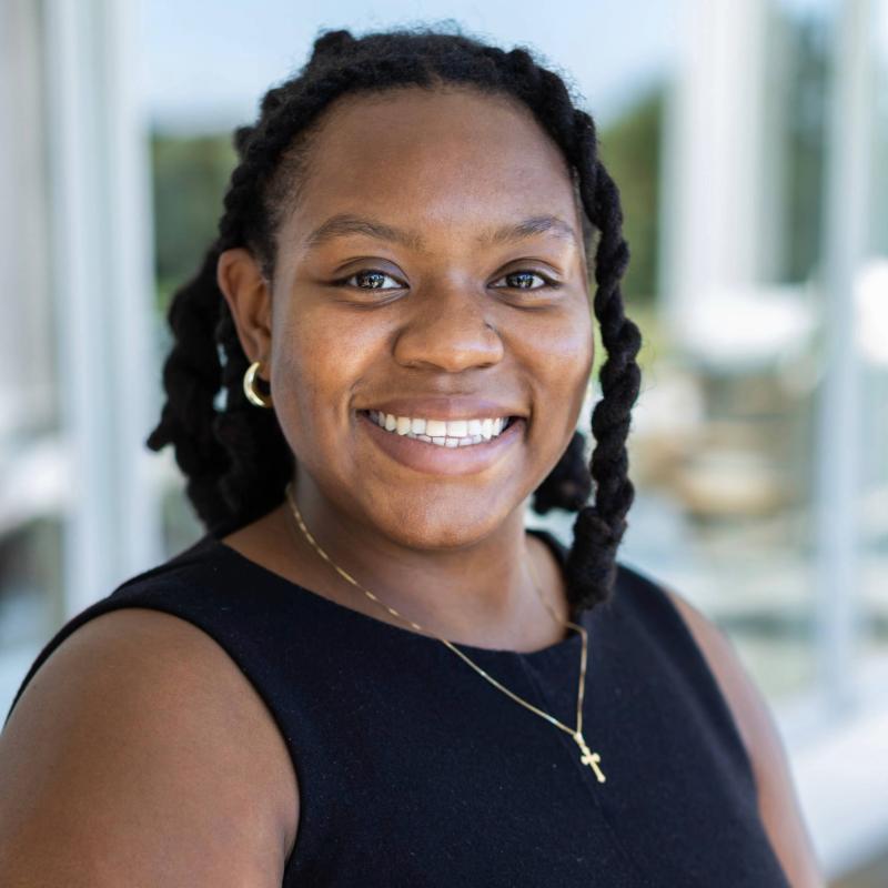 Headshot of Christina Chance smiling in a black shirt.