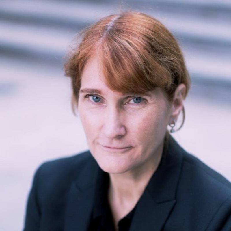 Picture of Christine Wilson smiling in a black blazer.